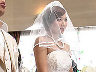 Asian hostess in super wet wedding dress